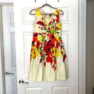 New Directions V neck sleeveless dress. Lined floral print with pleated skirt.